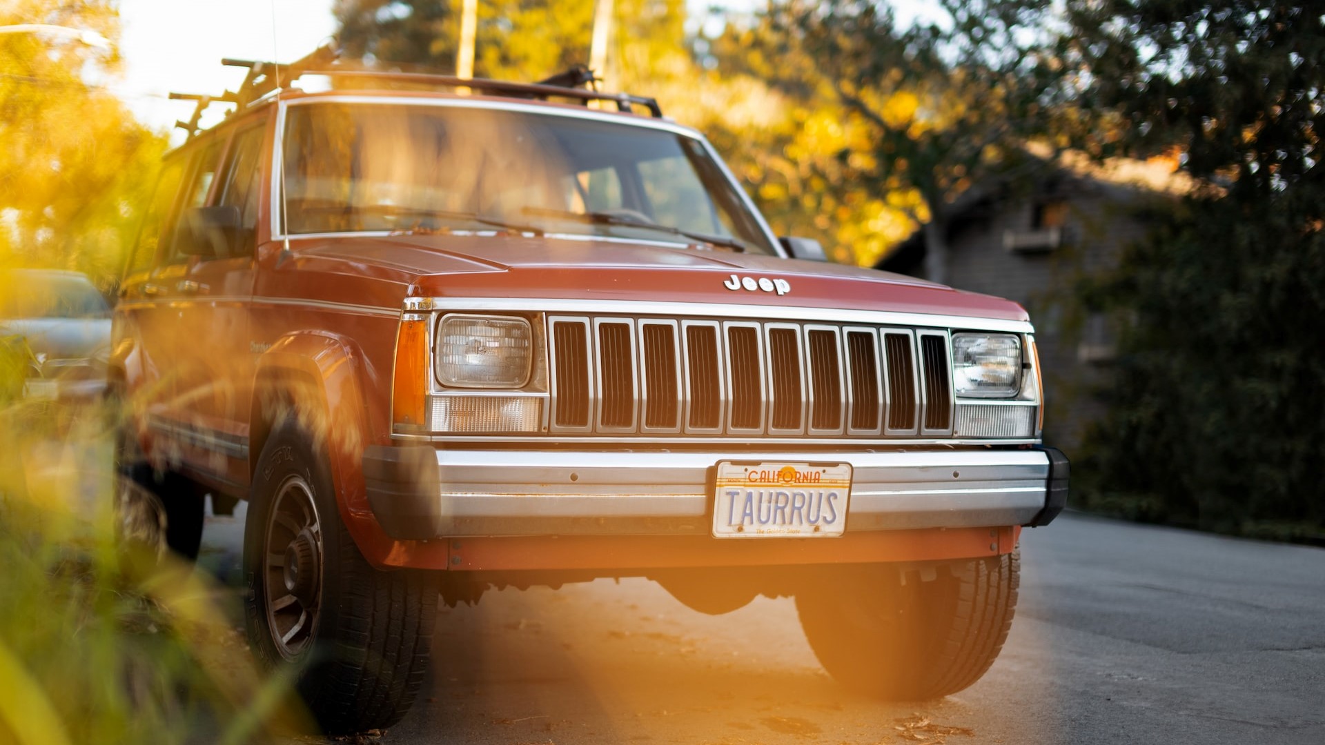 Red car parked on the street in Palo Alto, CA | Goodwill Car Donations