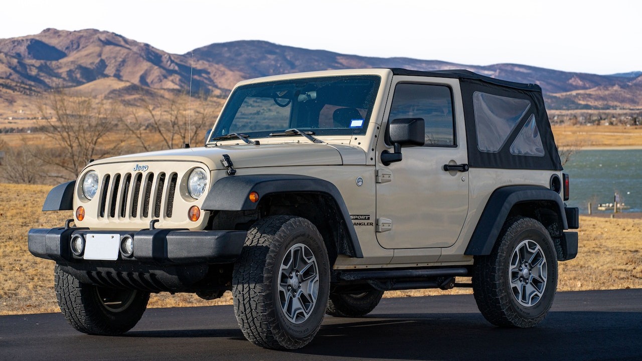 White Jeep Wrangler Parked on the Road | Goodwill Car Donations