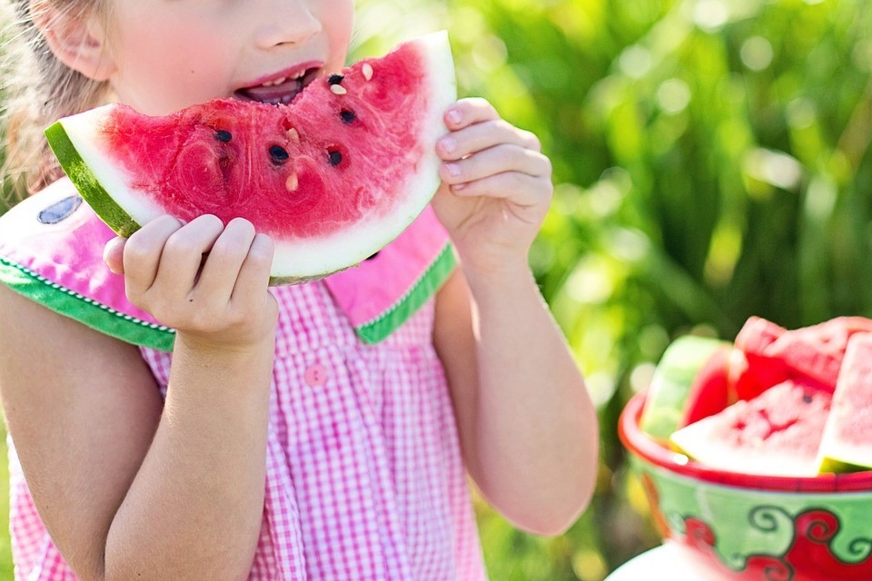 Girl Eating Fresh Watermermelons | Goodwill Car Donations