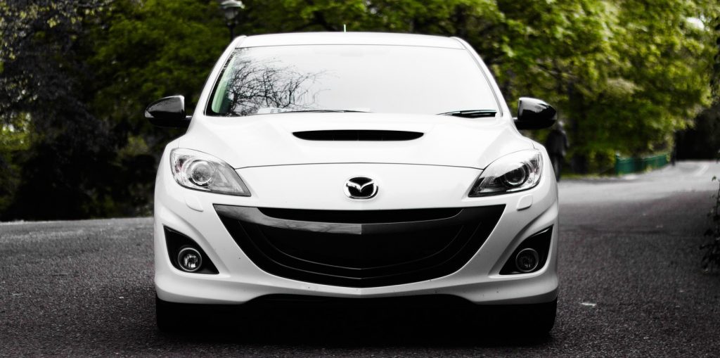 White Mazda on the Road in Watauga, Texas | Goodwill Car Donations