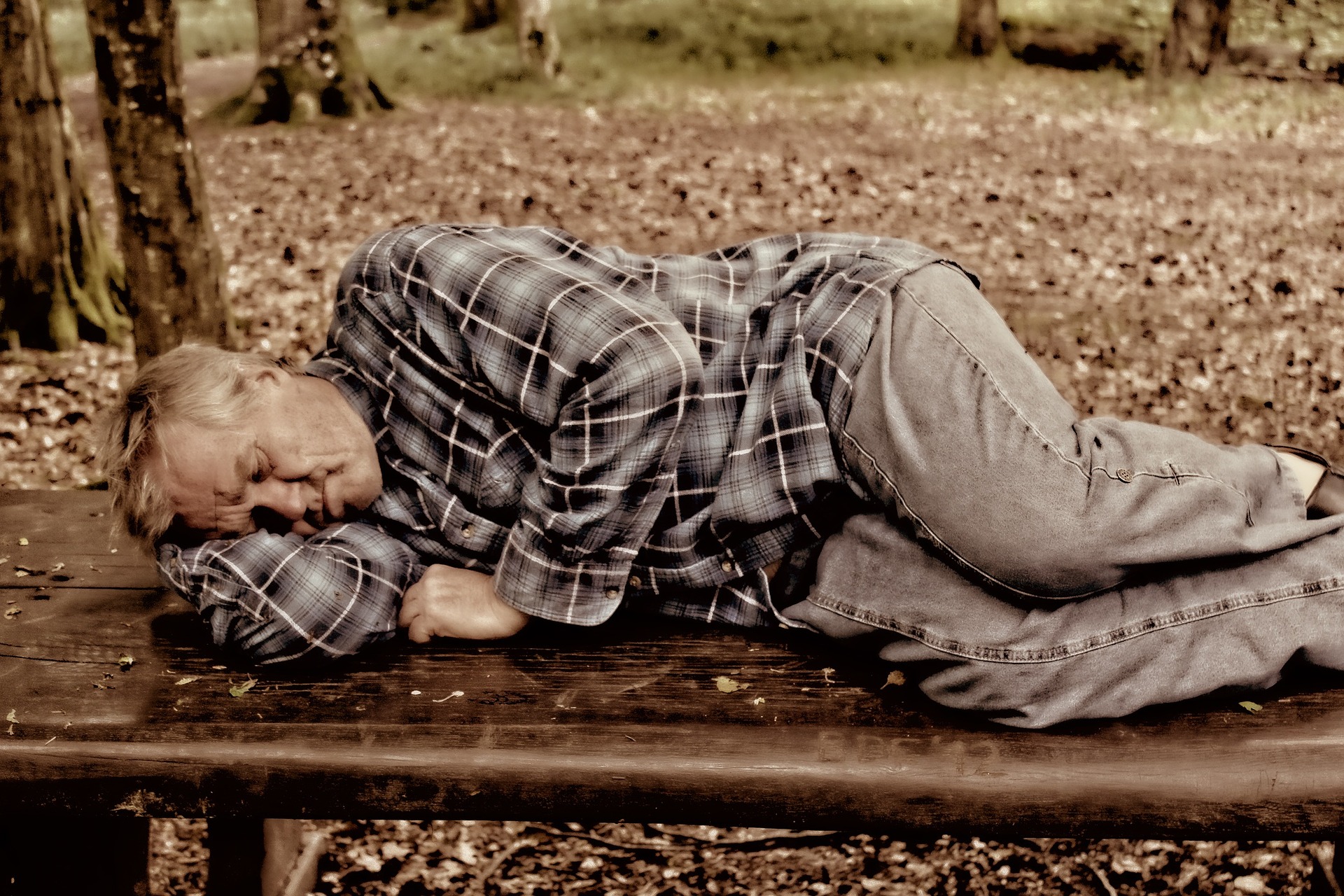 Homeless Man Sleeping Outdoors - GoodwillCarDonation.org