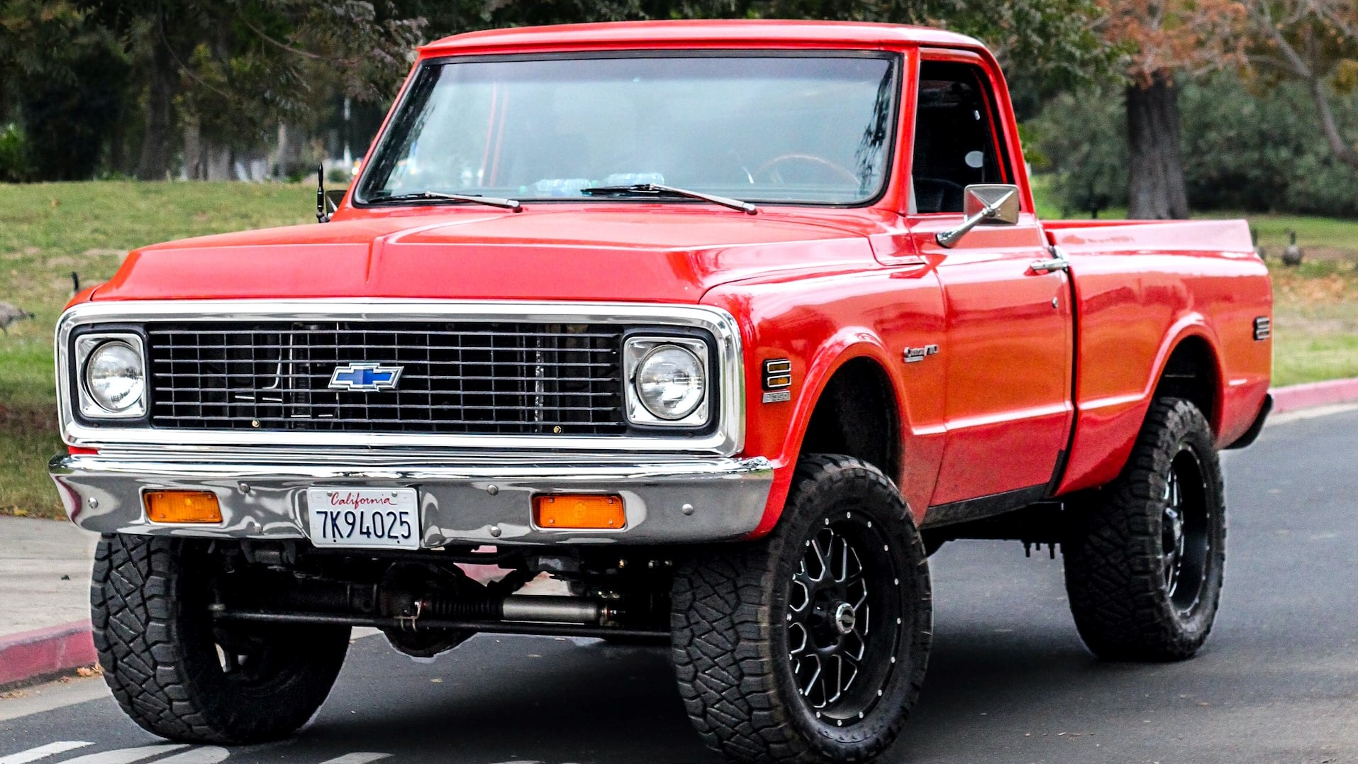 red chevrolet single cab pickup truck parked near green trees during daytime | Goodwill Car Donations