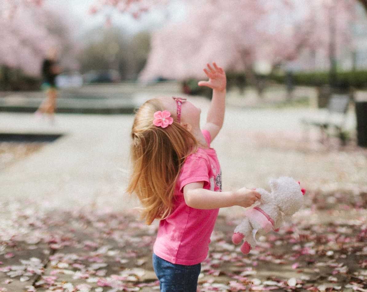 Kid Enjoying Spring Blossoms | Goodwill Car Donations