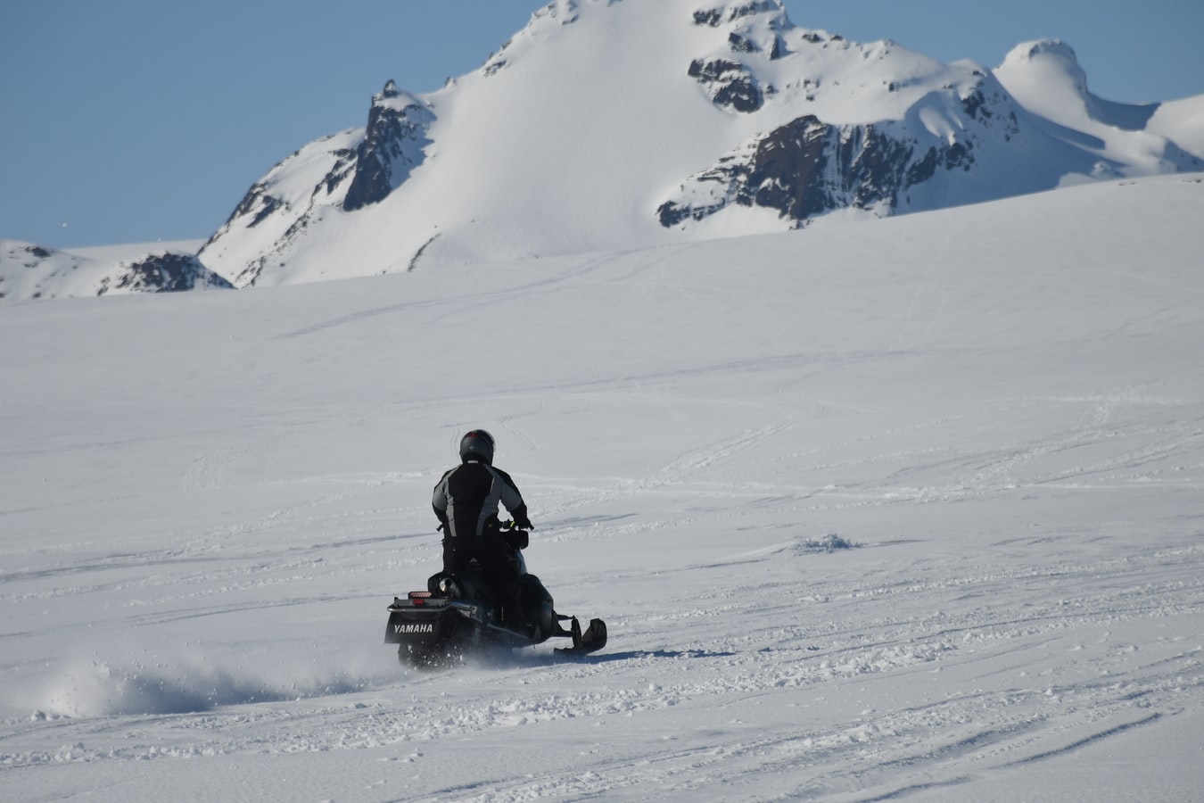 Person Riding a Snowmobile | Goodwill Car Donations