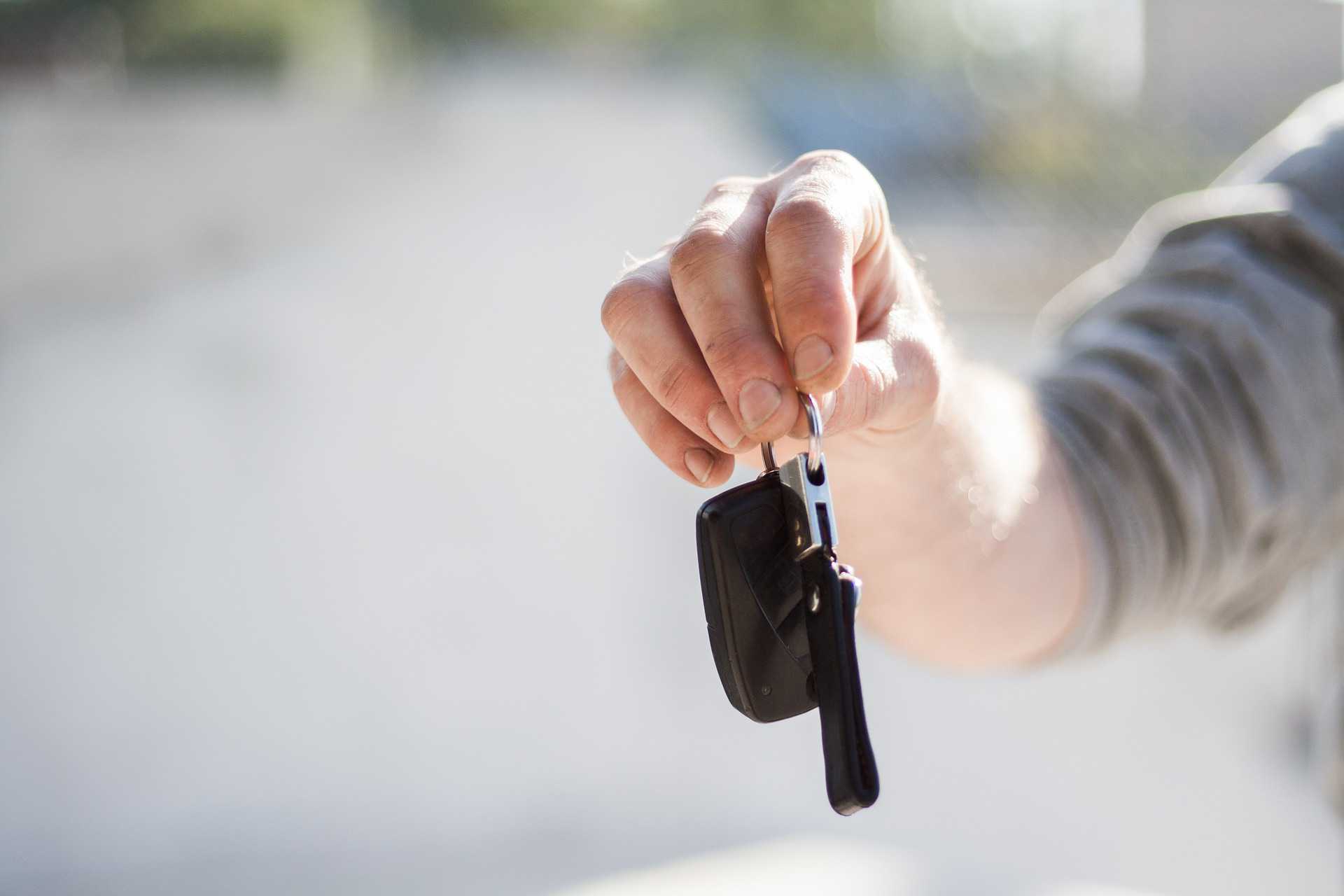 Person Holding a Car Key | Goodwill Car Donations