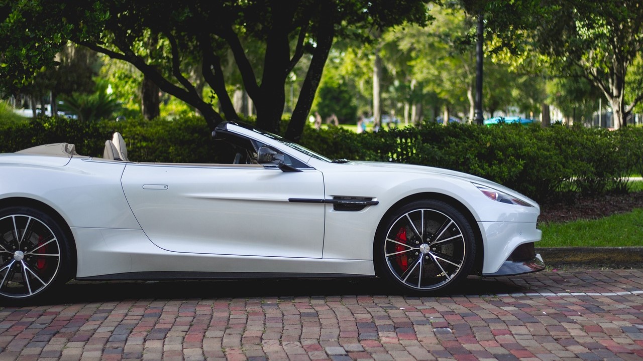 White convertible parked in sidewalk | Goodwill Car Donations