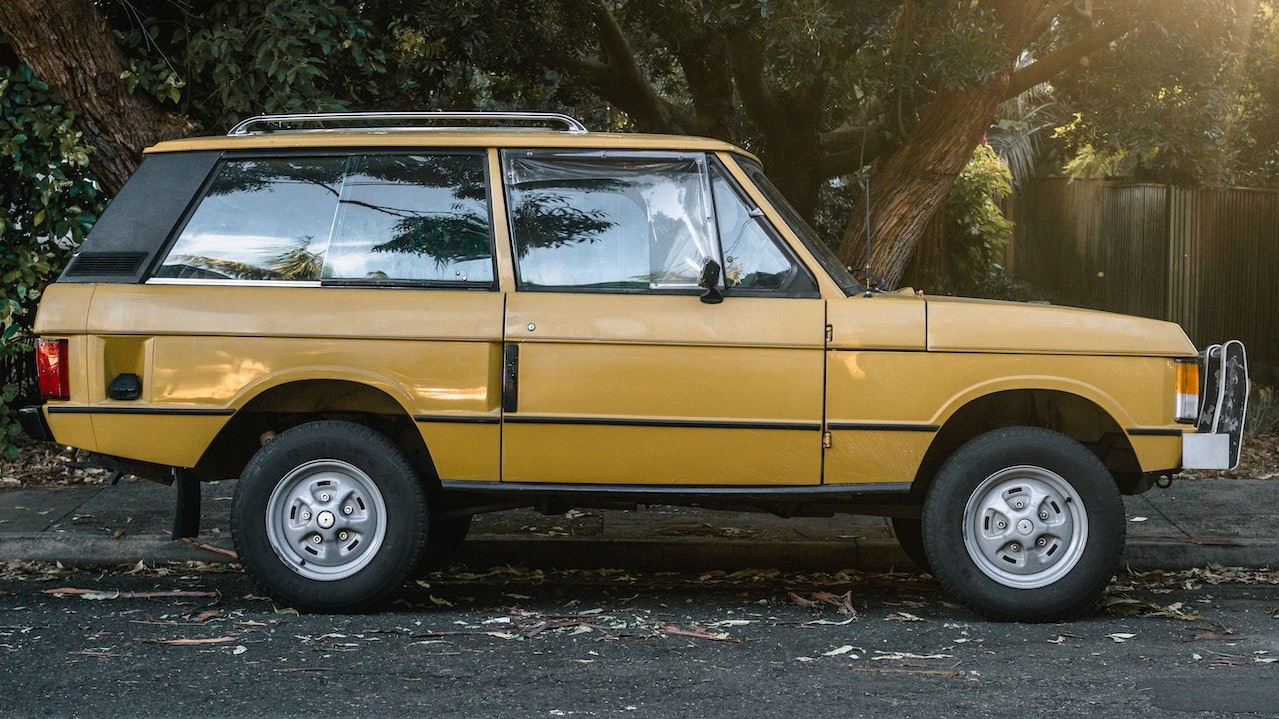 Yellow suv parked near a tree | Goodwill Car Donations