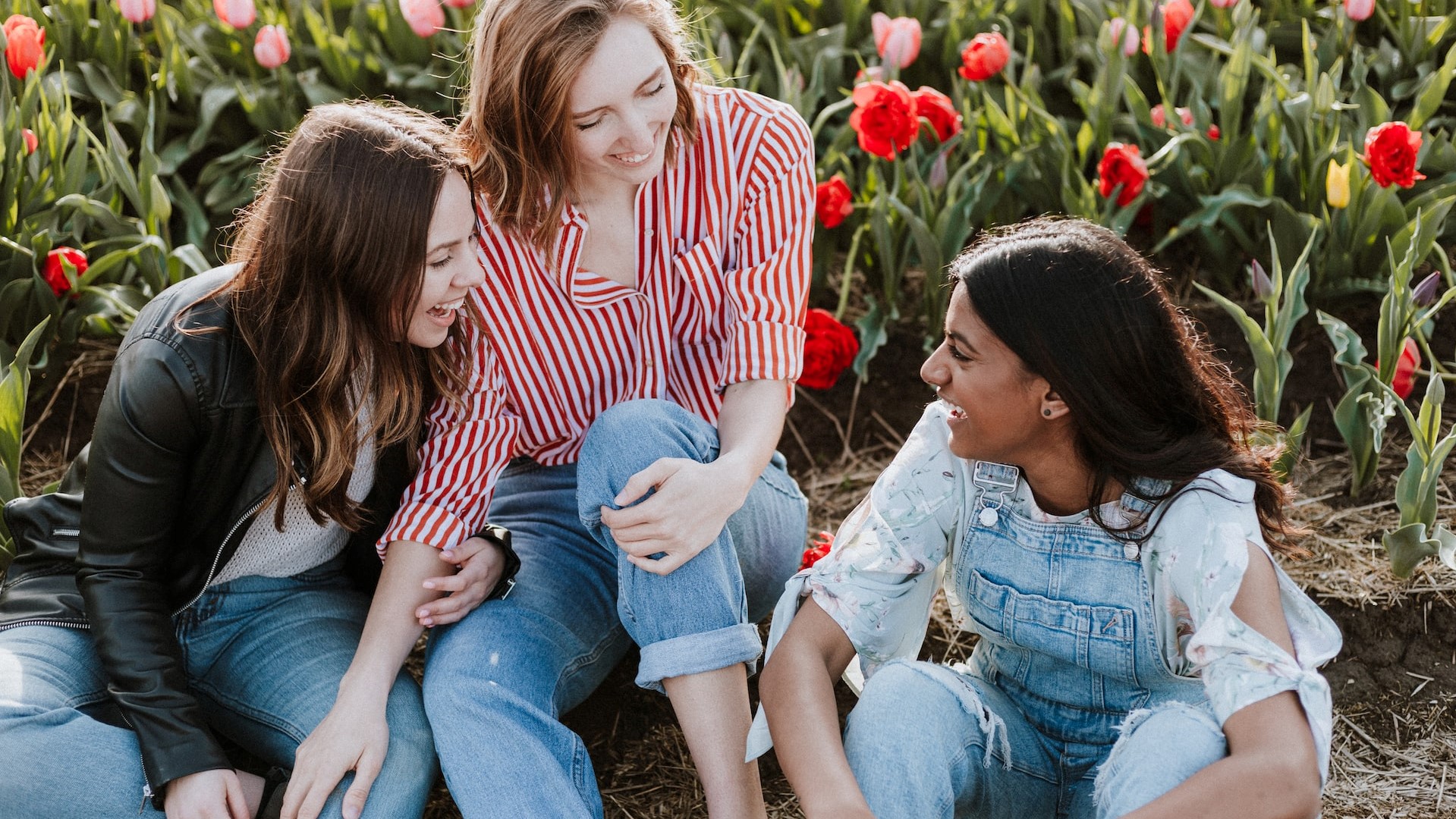 three woman sitting near the flower photo | Goodwill Car Donations