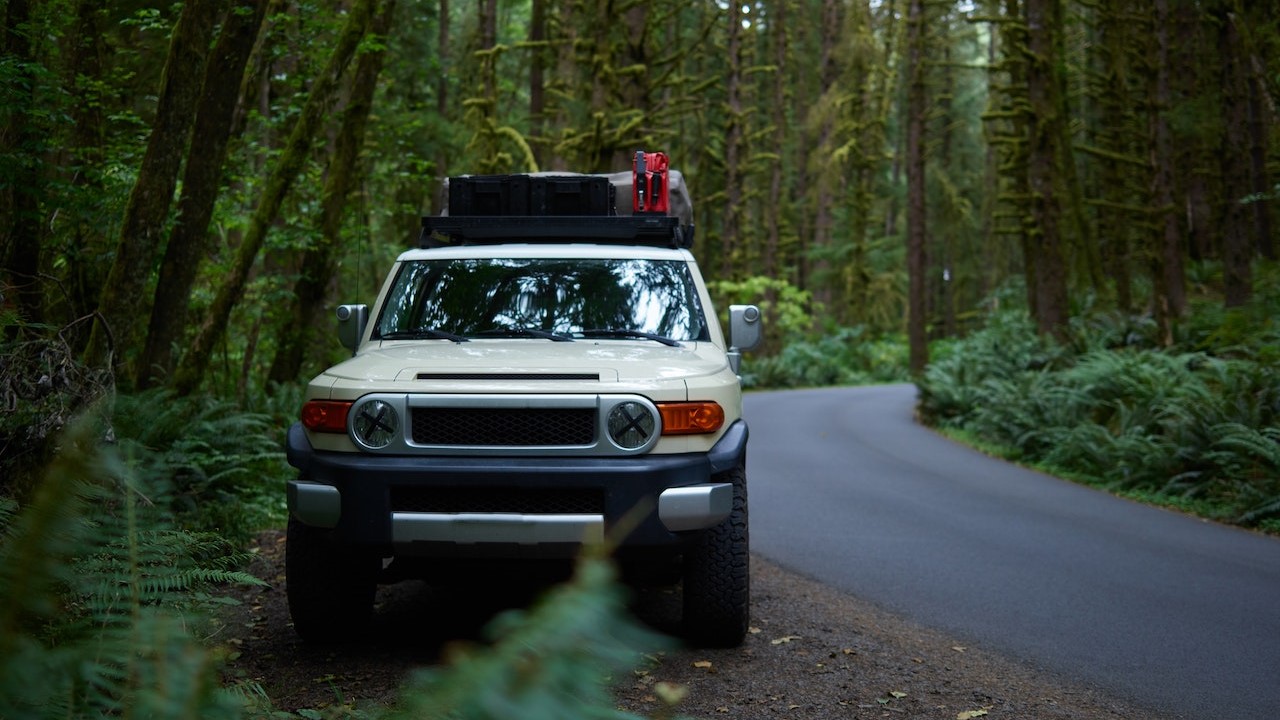 Off road car parked on roadside in forest | Goodwill Car Donations