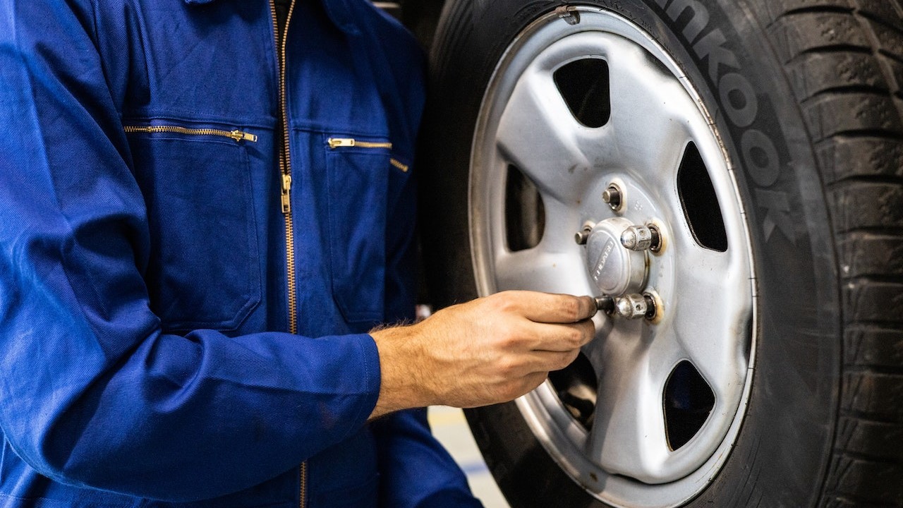 Person Holding a Tire | Goodwill Car Donations