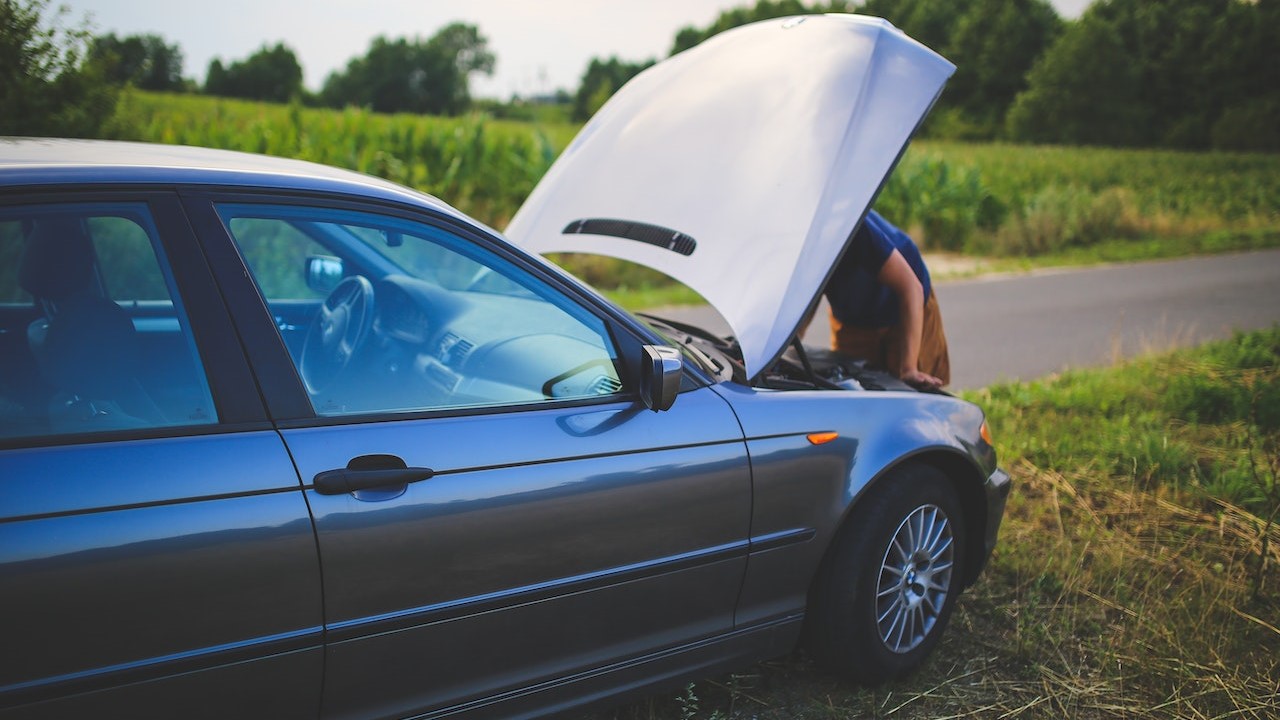 Person fixing his car | Goodwill Car Donations