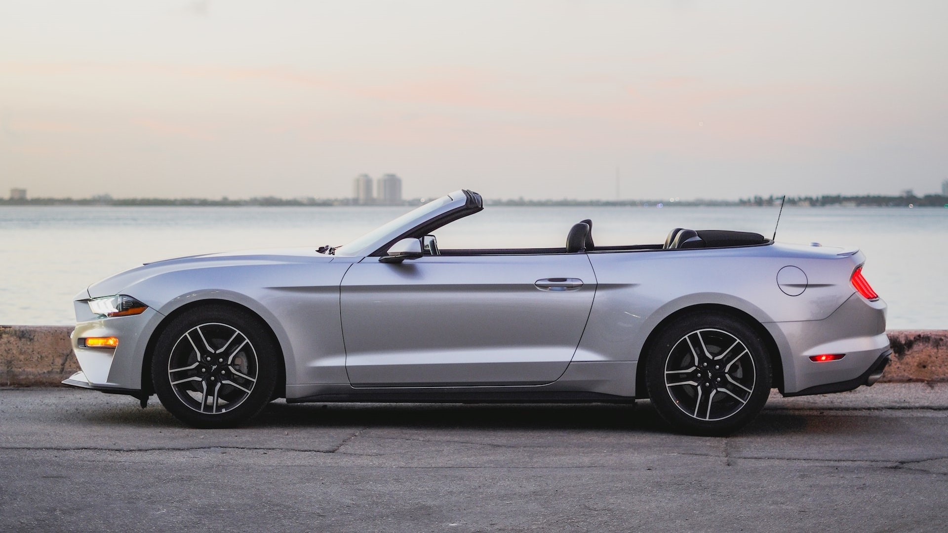 Silver convertible car parked near the shore | Goodwill Car Donations