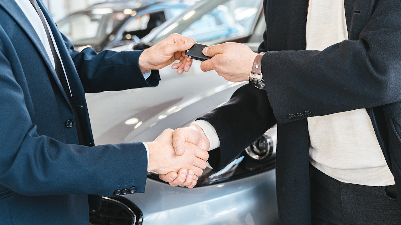 Man giving a key after the sale | Goodwill Car Donations