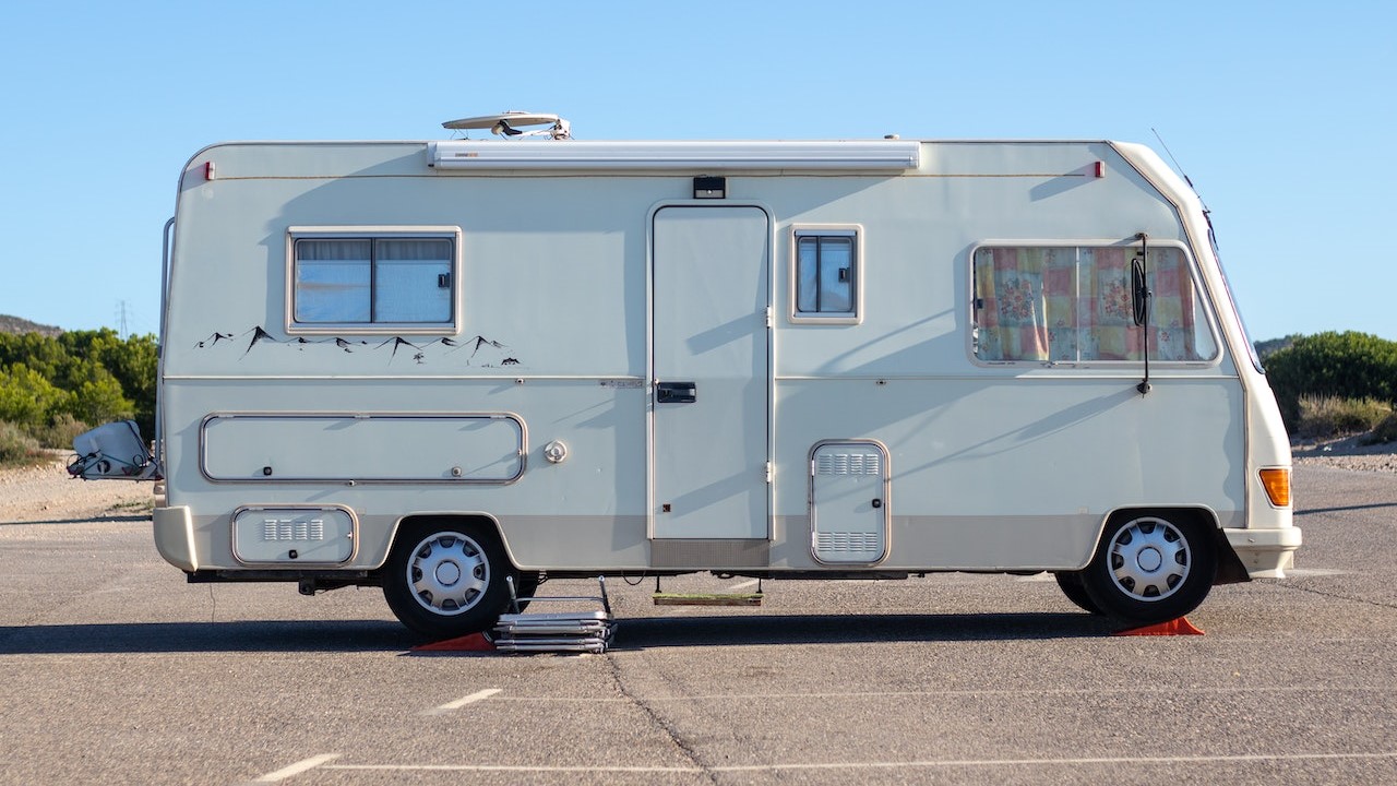 White Camper Van Parked on the Road | Goodwill Car Donations