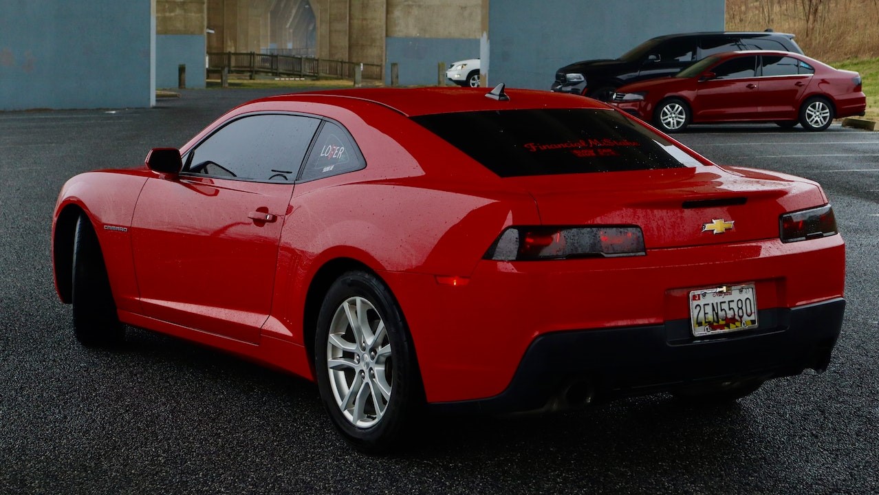 A Red Sportscar Wet by the Rain | Goodwill Car Donations