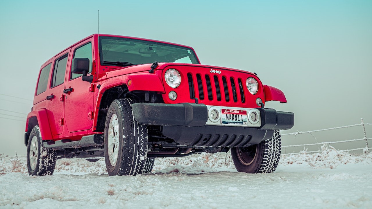 Red Suv on Snow Covered Ground | Goodwill Car Donations