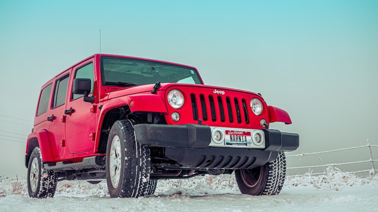 Red Suv on Snow Covered Ground | Goodwill Car Donations