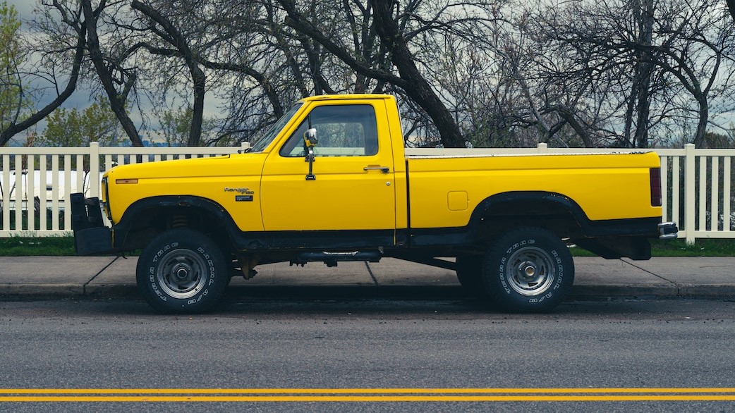 Yellow Truck Parked on the Road | Goodwill Car Donations