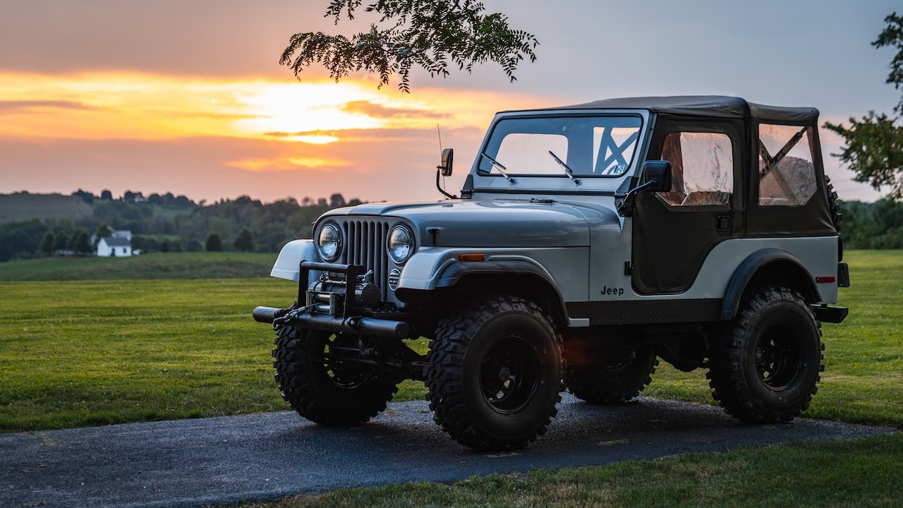 Gray Jeep Wrangler on Green Grass Field  | Goodwill Car Donations