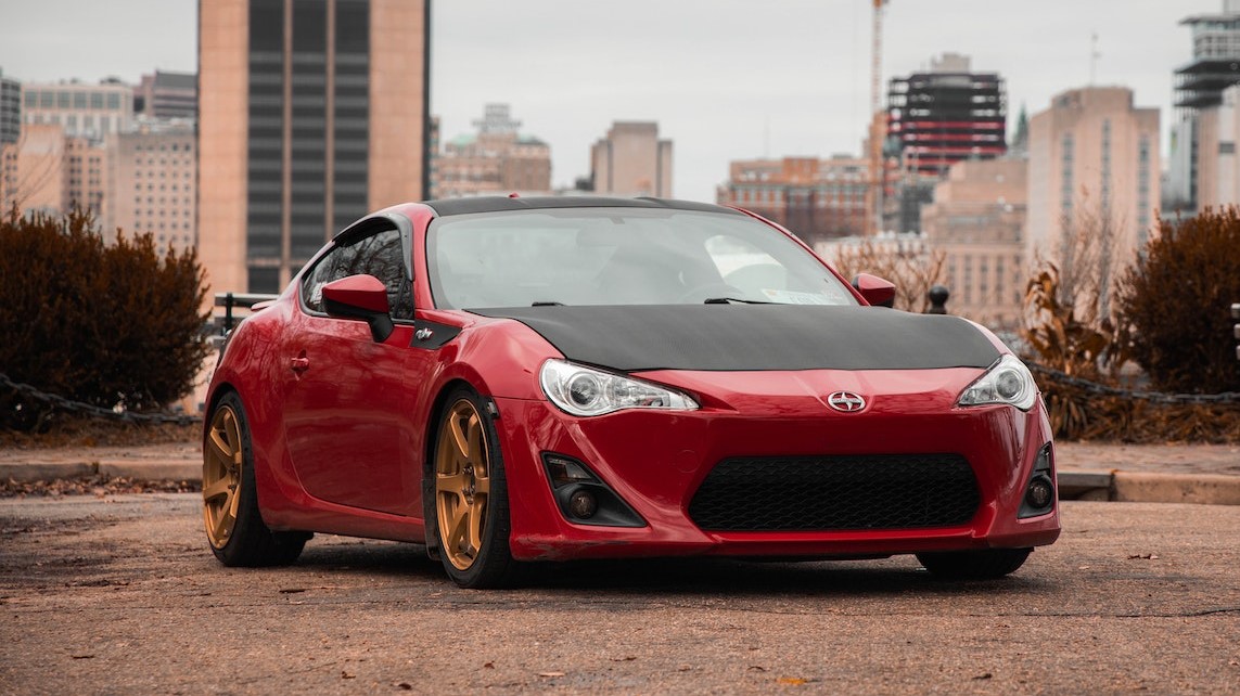 Red Car Parked on the Street | Goodwill Car Donations