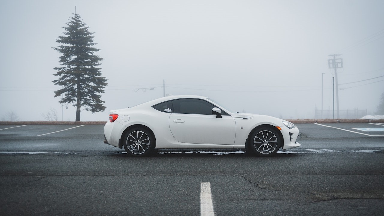 Sport car parked on empty road | Goodwill Car Donations