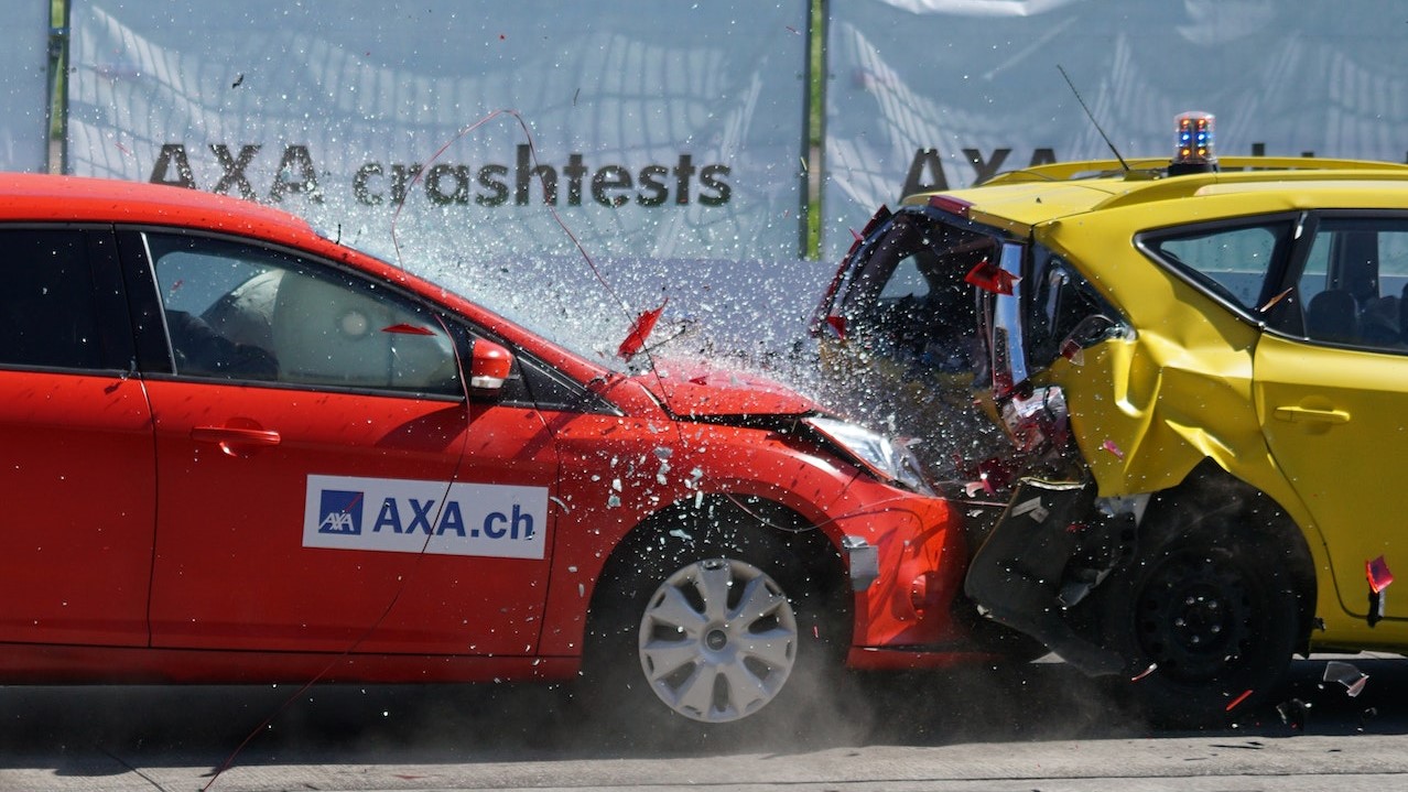 Red and Yellow Hatchback Axa Crash Tests | Goodwill Car Donations