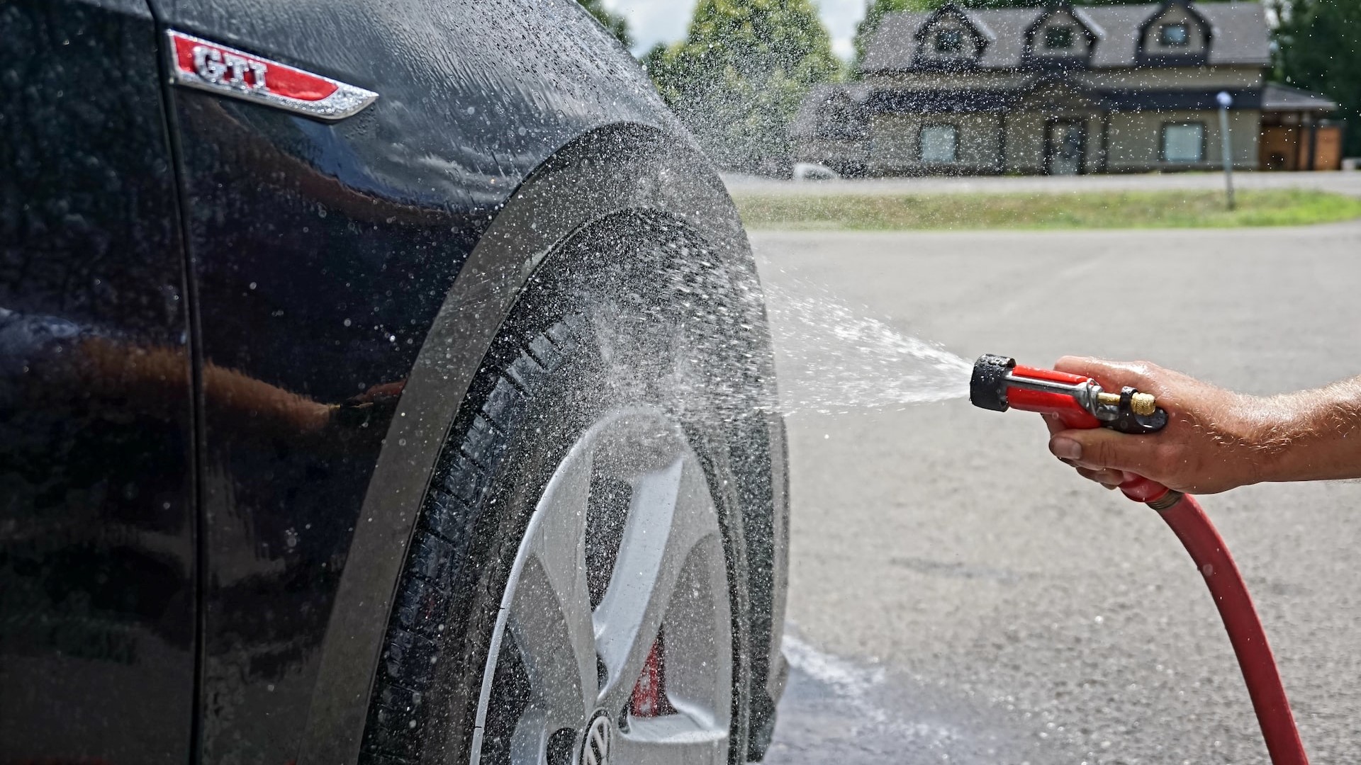 Person washing a car | Goodwill Car Donations