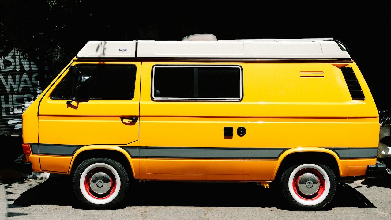 Side View of a Parked Yellow Van | Goodwill Car Donations