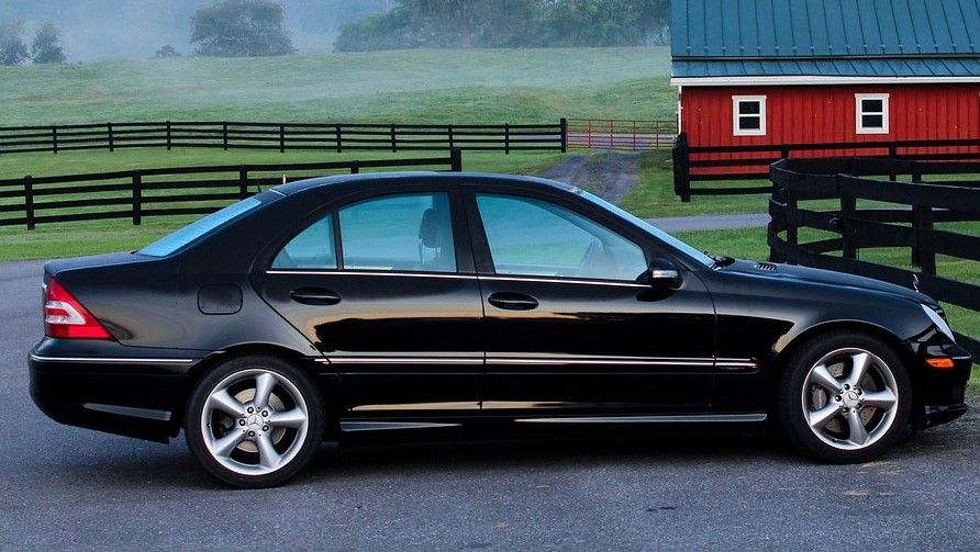 Black Car Parked in a Barn | Kids Car Donations