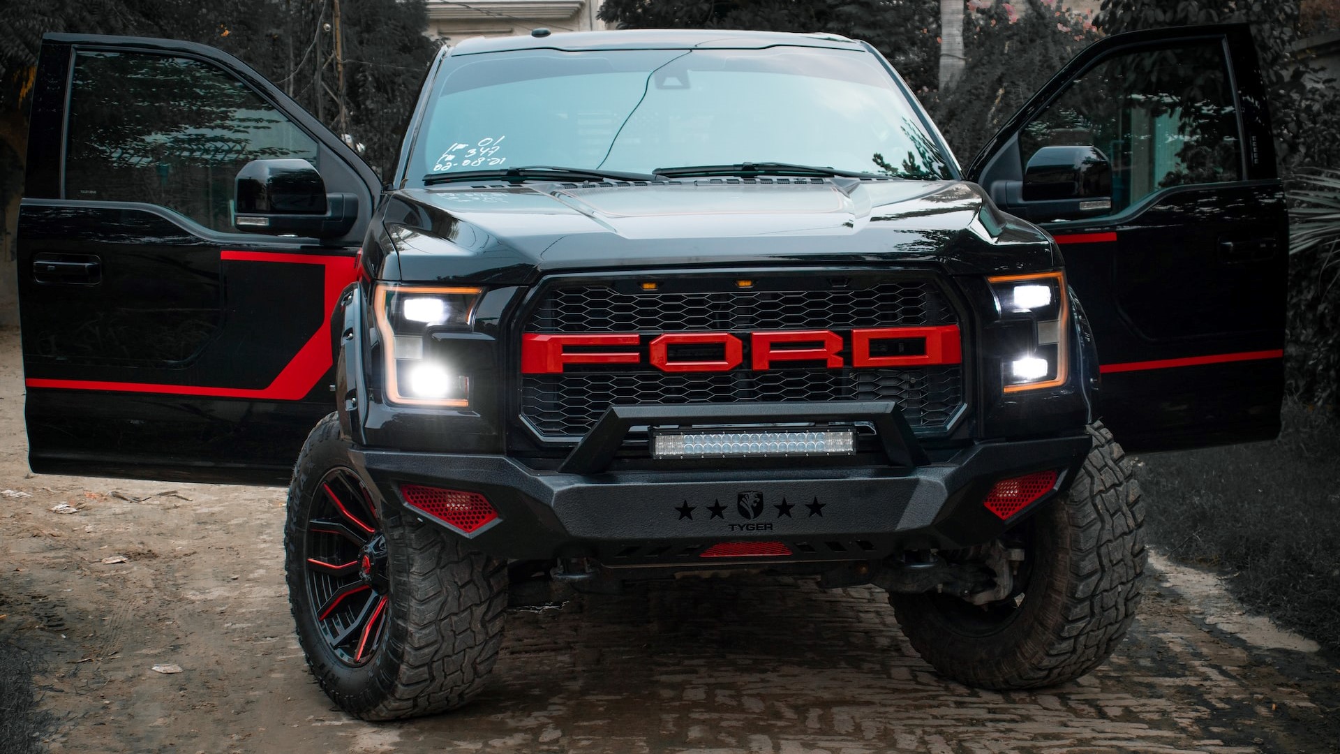 Red and Black Ford Raptor | Goodwill Car Donations