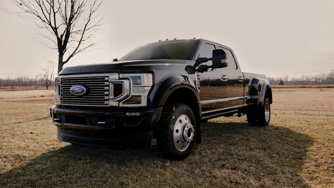 White Ford F 150 Crew Cab Pickup Truck on Grass Field | Goodwill Car Donations