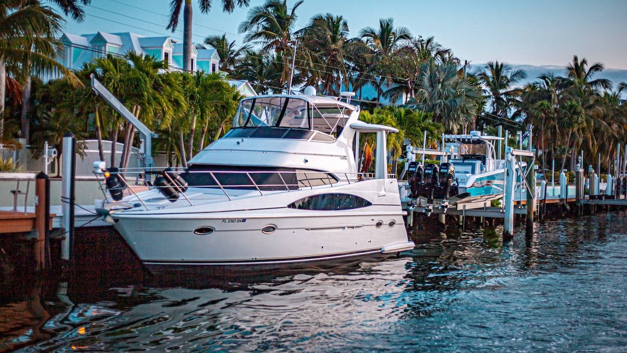 White Yacht Docked on a Harbour | Goodwill Car Donations