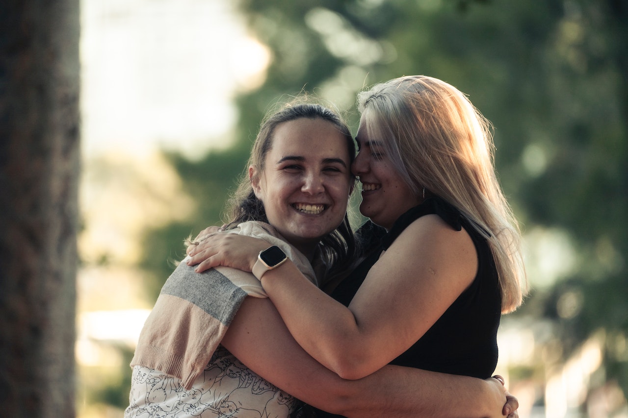 Happy Women Hugging Each Other | Goodwill Car Donations