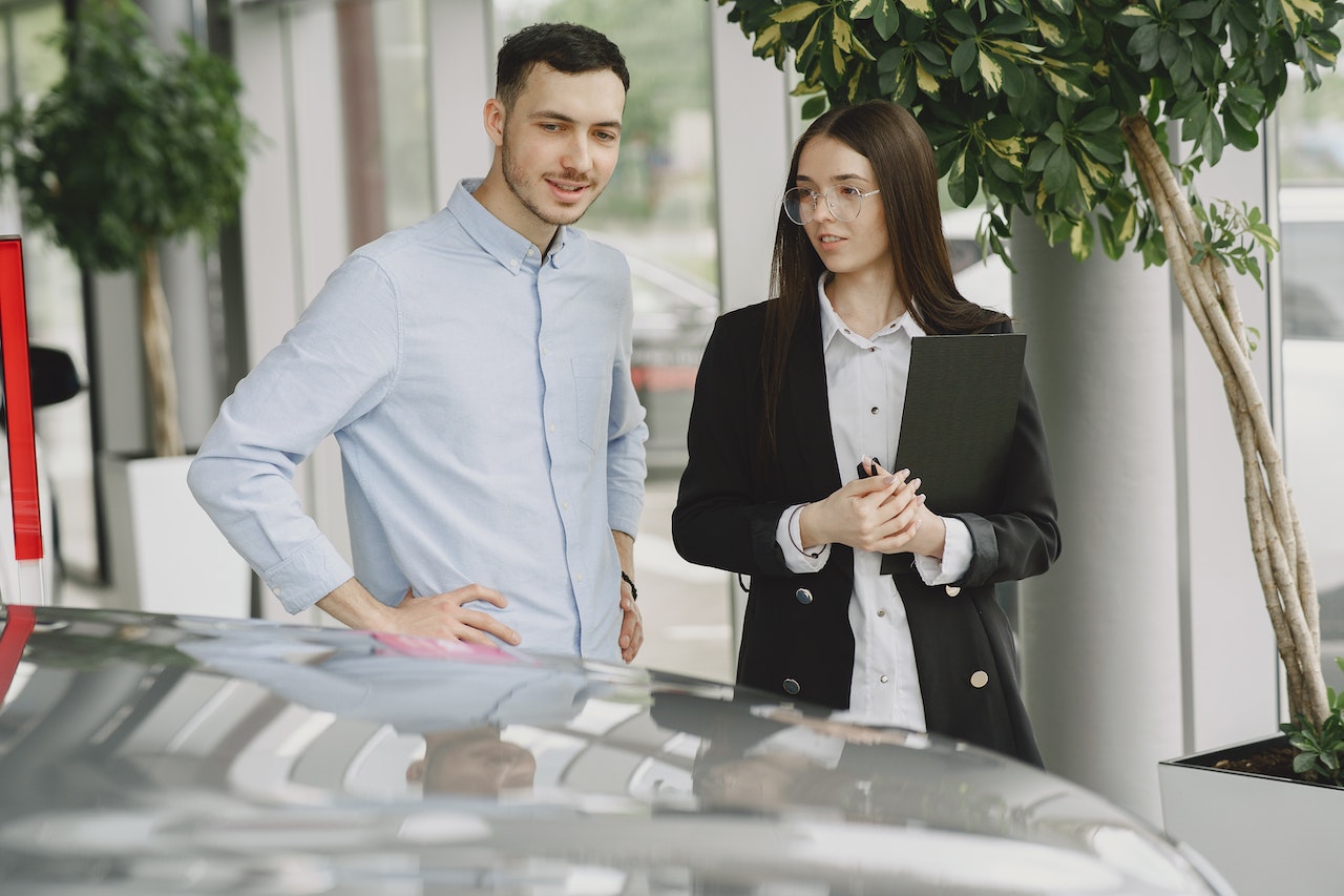 Man and Woman Looking at a Car | Goodwill Car Donations