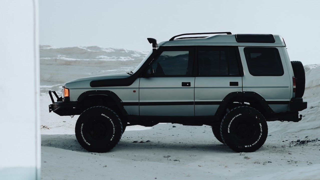 Silver Land Rover SUV Parked on Snow Covered Ground | Goodwill Car Donations