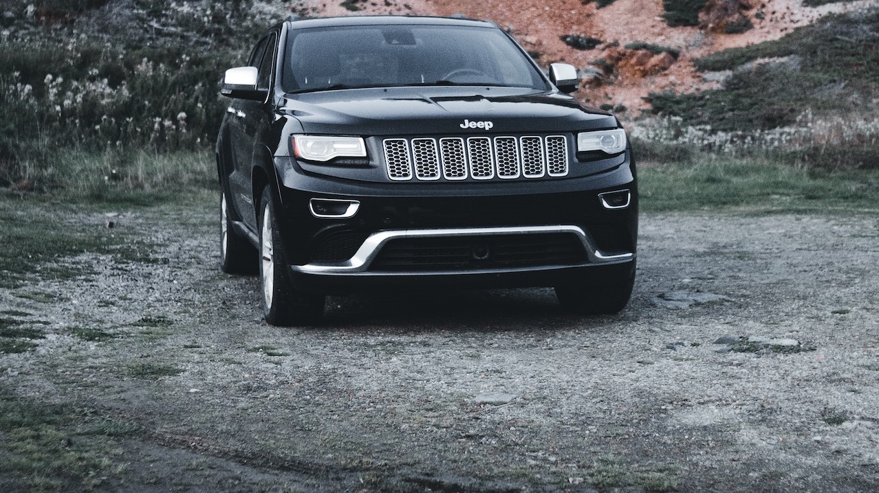 A Black Car Parked on a Dirt Road | Goodwill Car Donations