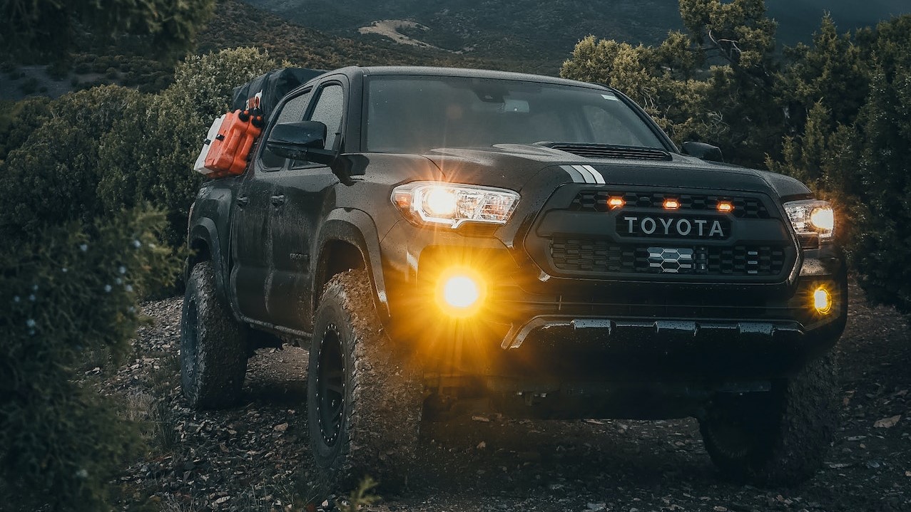 A Black Pick Up Truck on Mountain Near the Trees | Goodwill Car Donations