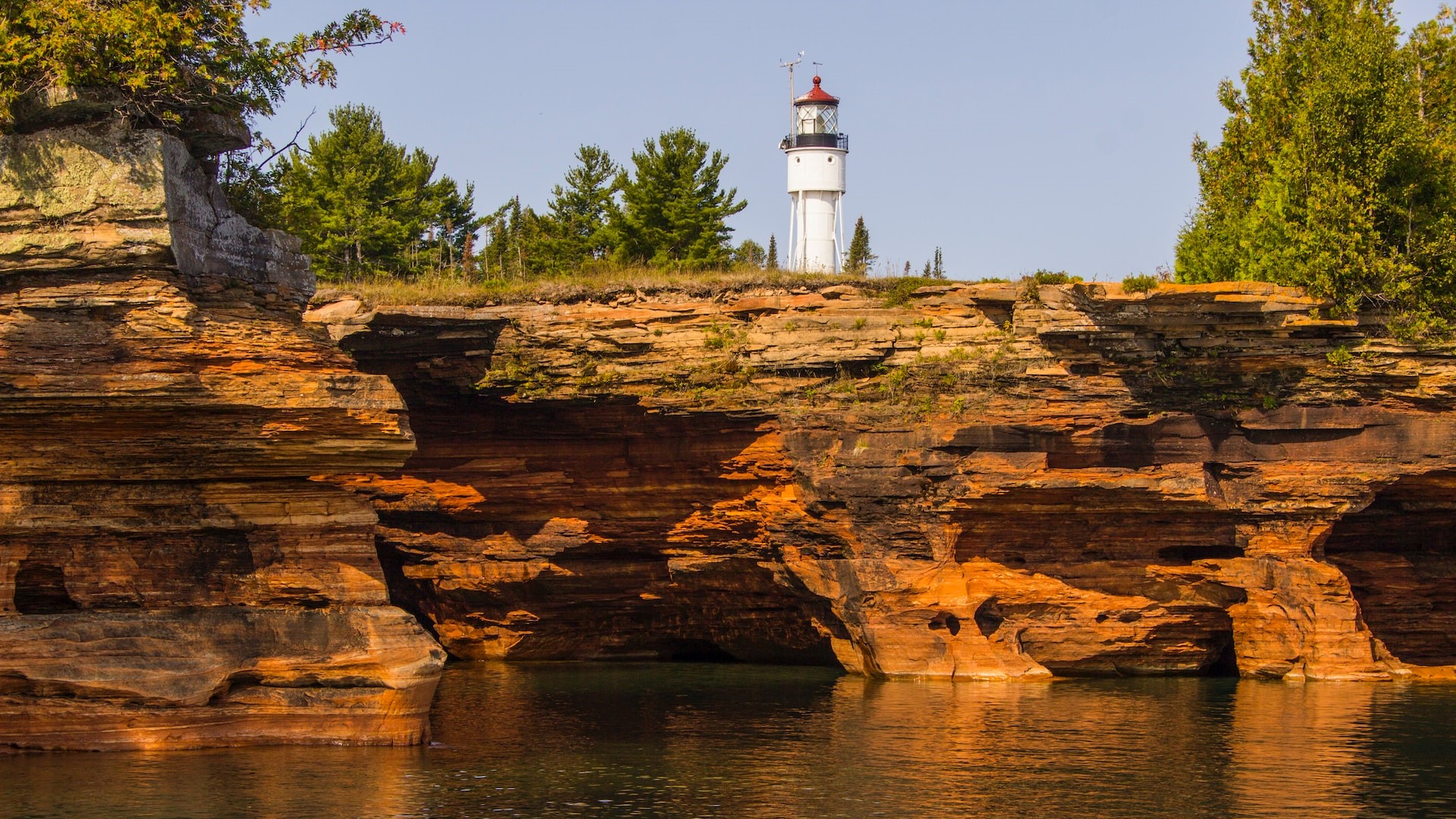 A lighthouse sits on top of devils island of the Apostle Islands in Lake Superior | Goodwill Car Donations