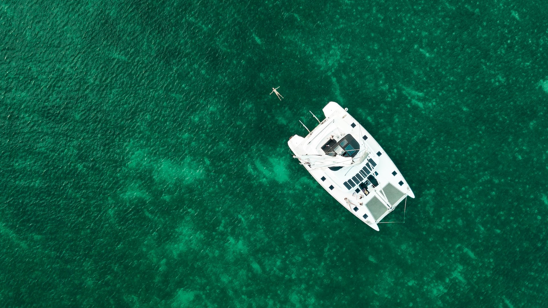 Aerial View of White Boat in the Middle of the Sea | Goodwill Car Donations
