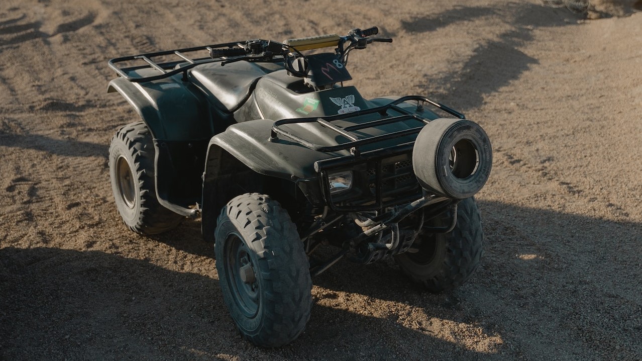 Black and Gray Atv on Brown Sand | Goodwill Car Donations