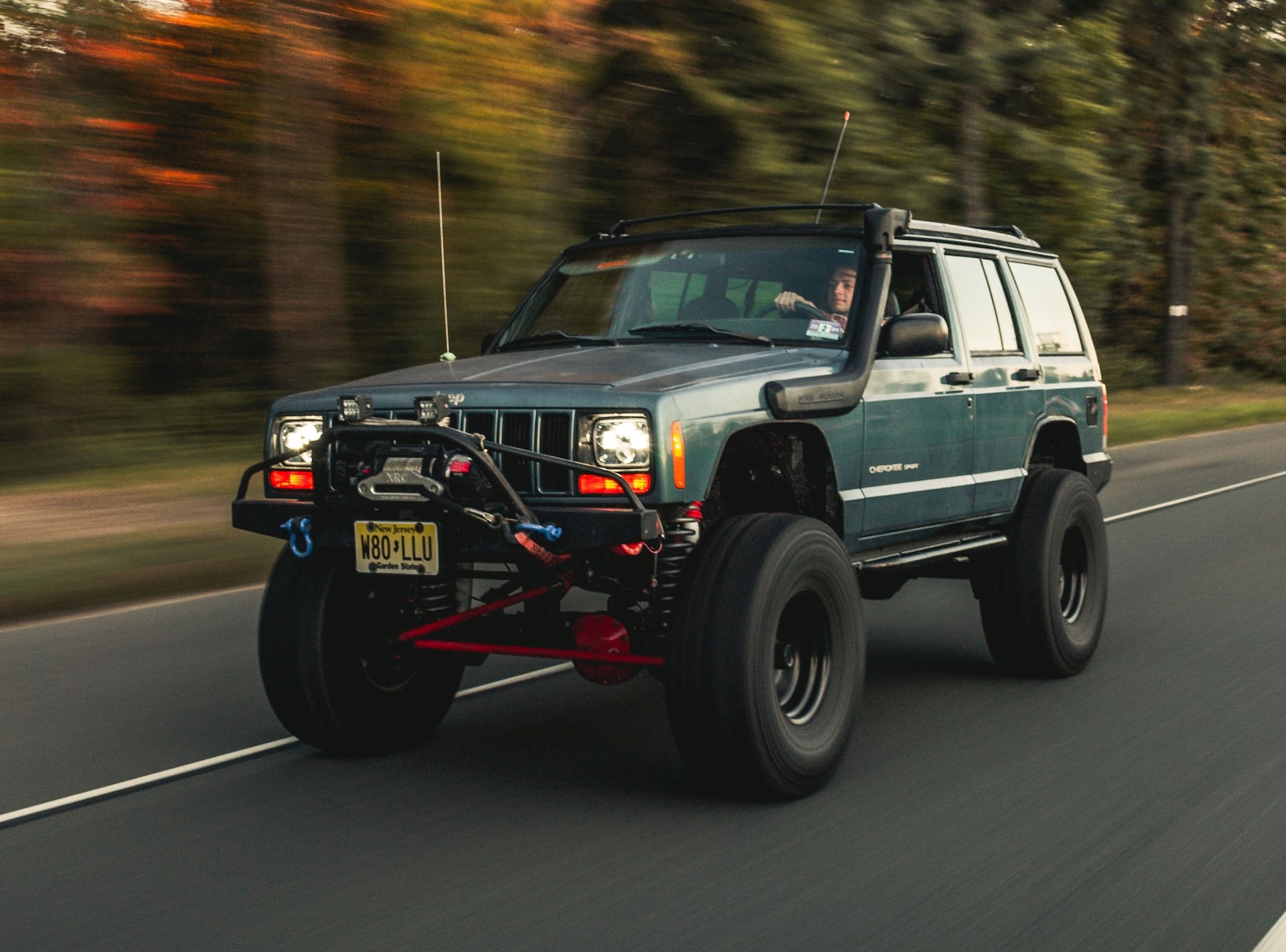 Blue Jeep on the Road | Goodwill Car Donations