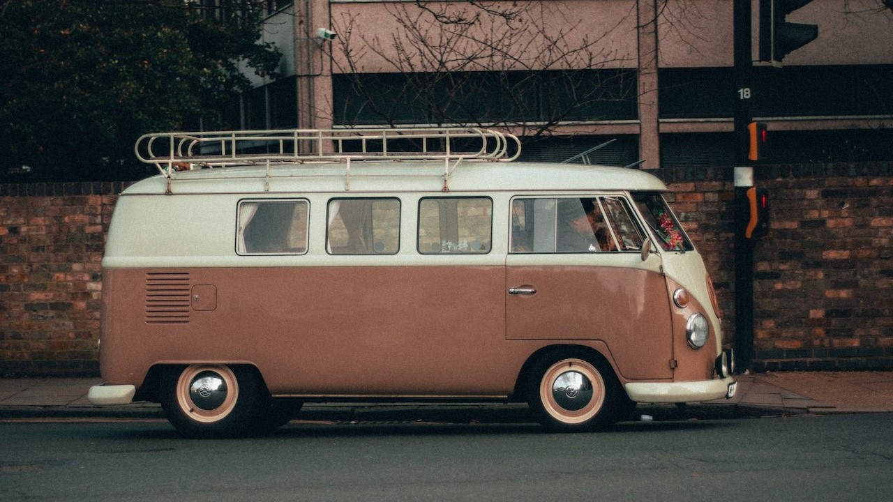 Brown and white volkswagen parked | Goodwill Car Donations