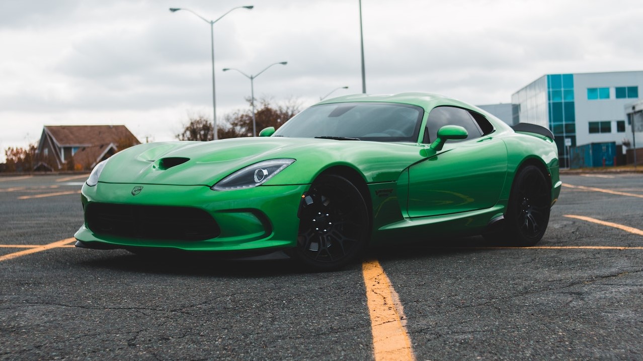 Green Porsche 911 on Road | Goodwill Car Donations