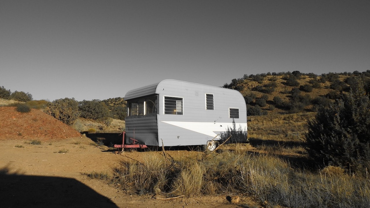 Grey rv trailer parked | Goodwill Car Donations