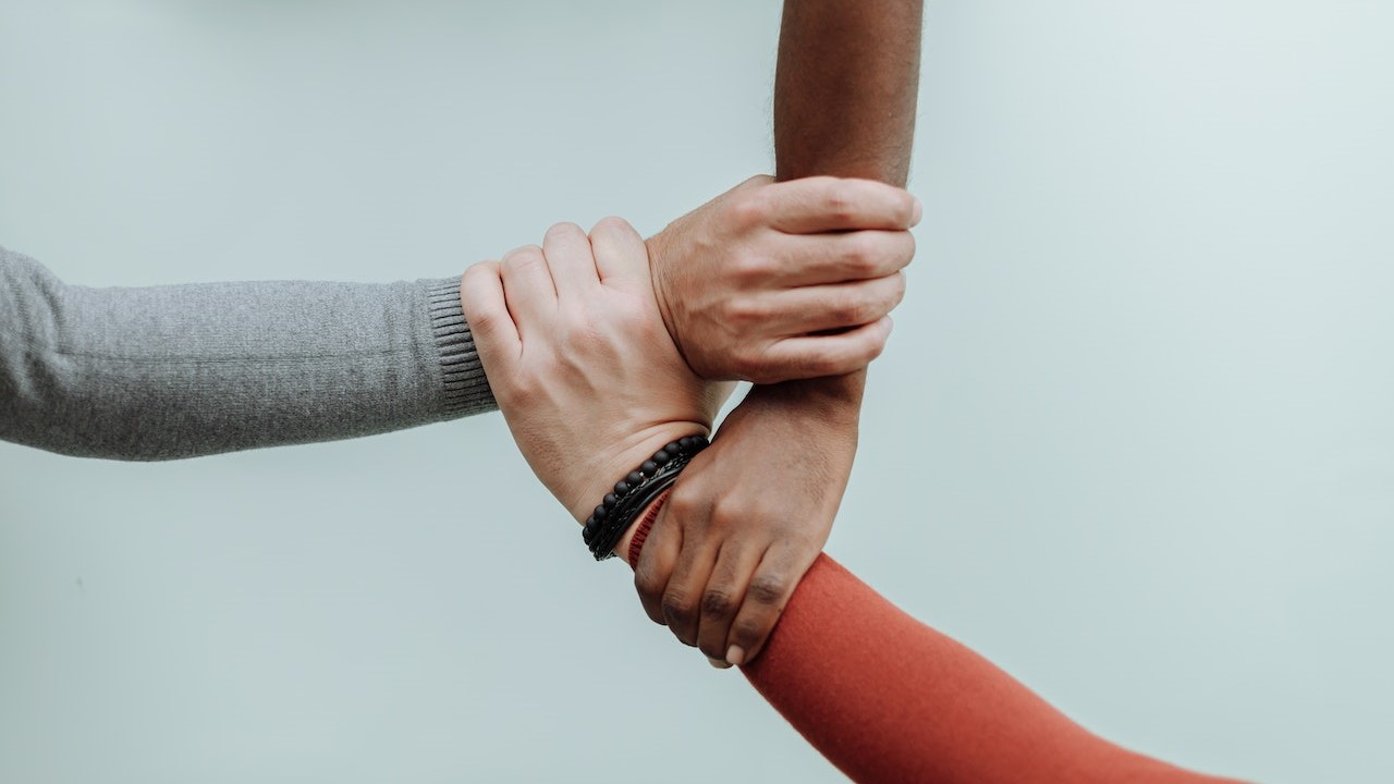 Hands Together on White Background | Goodwill Car Donations