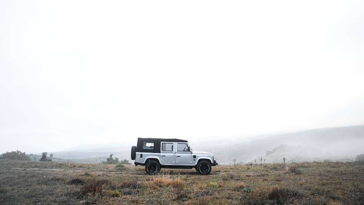 Land Rover Defender Parked on a Field | Goodwill Car Donations