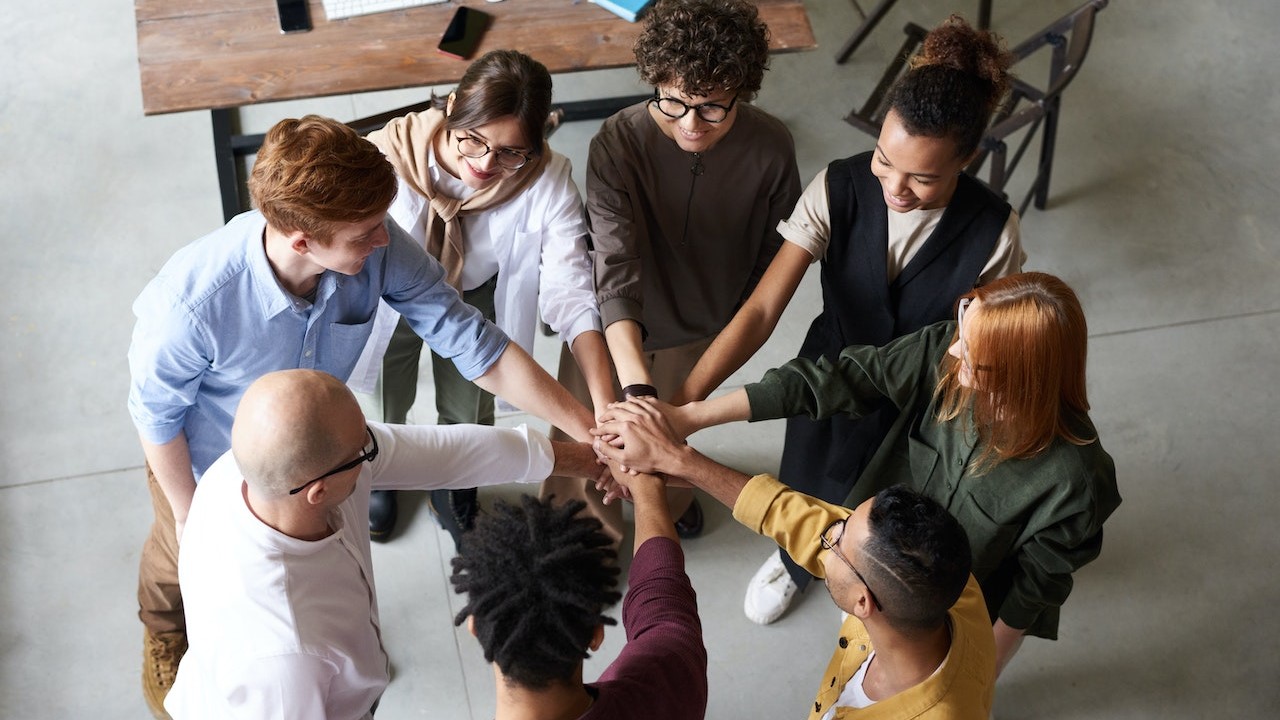 Photo Of People Holding Each Other's Hands | Goodwill Car Donations