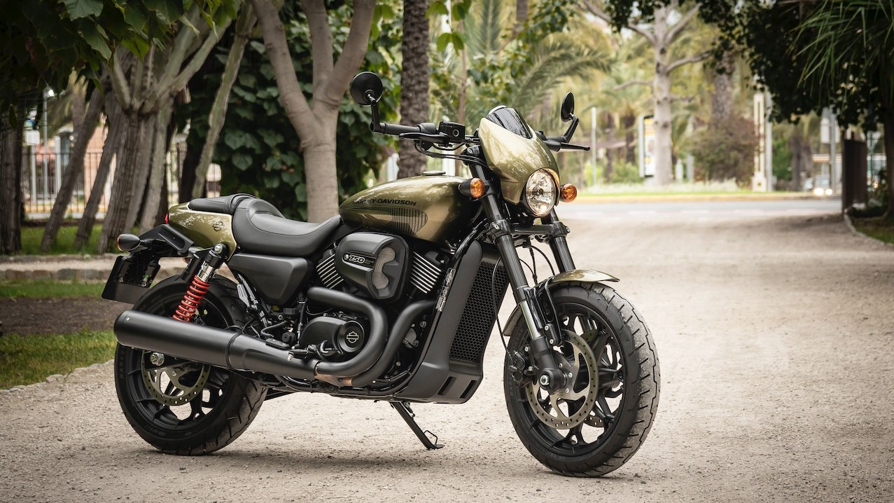 Photo of Black and Brown Harley Davidson 750 Parked on Gravel Road | Goodwill Car Donations