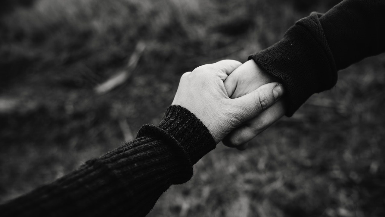 Photo of Holding Hands | Goodwill Car Donations