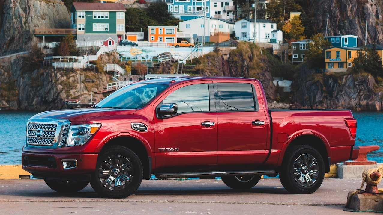 Red Crew Cab Pickup Truck Parked Near Brown Mountain | Goodwill Car Donations